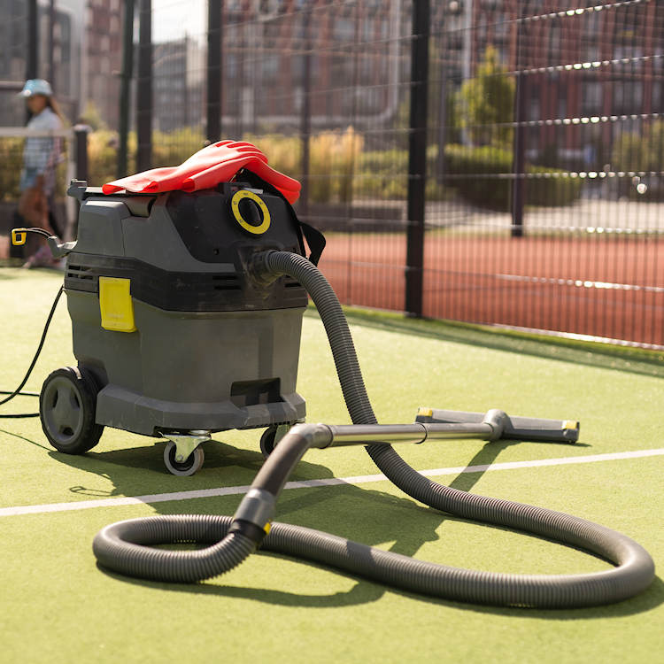 Cleaning a tennis court2 Tennis Court Cleaning
